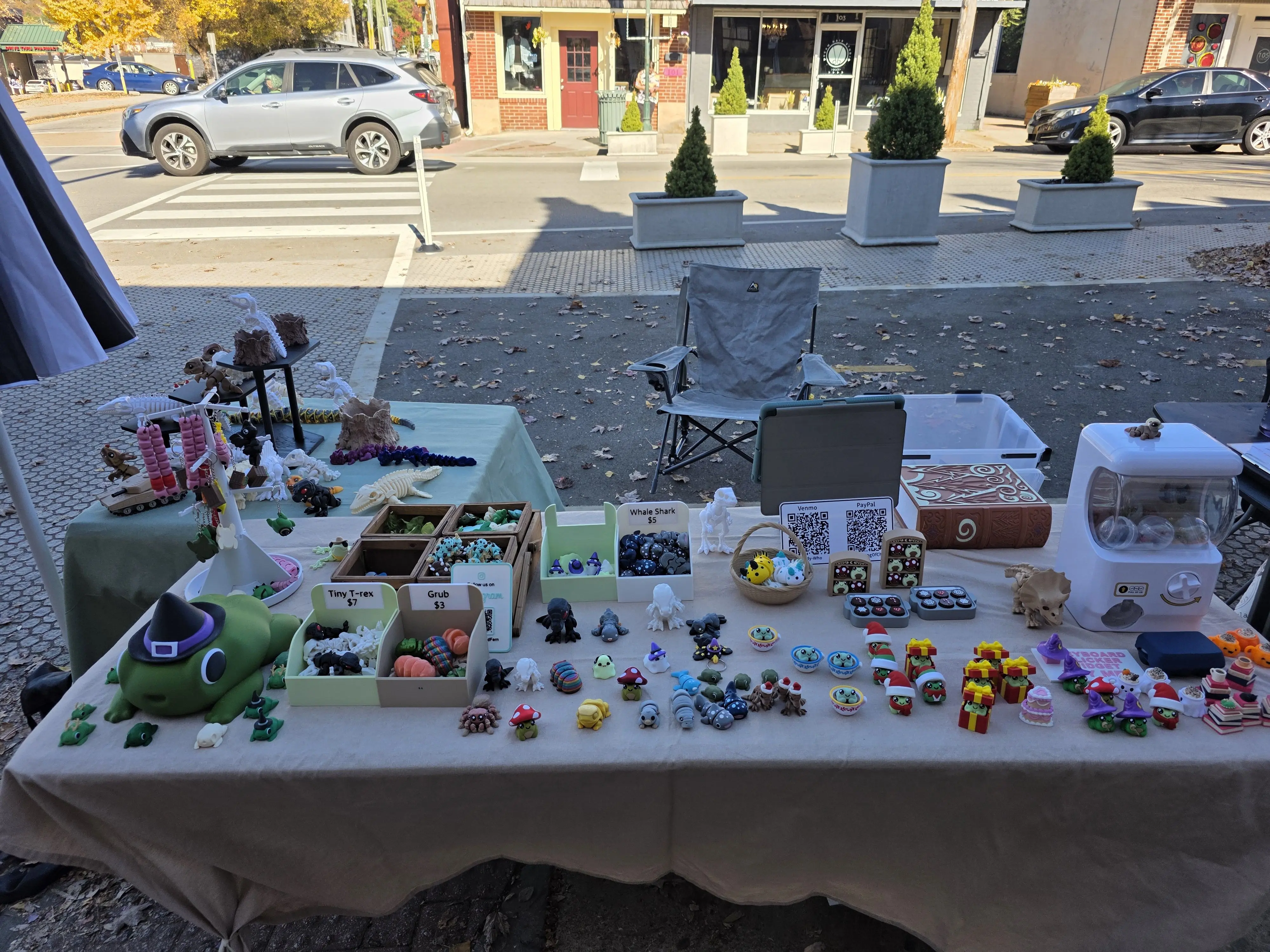 Frog & Fern table at the Frazier Street Market with toys and planters on display.